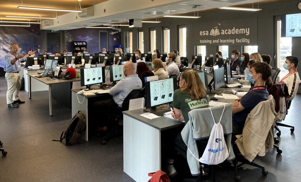 Expert delivering a lecture during an ESA Academy training course pillars