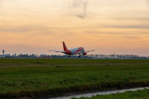 easyJet plane takes off from runway pillars