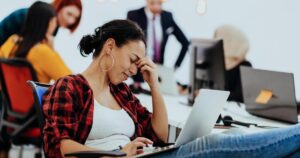 tired businesswoman sitting in an office and working on her laptop photo 1782376435139 1782376435534338125451 126 0 676 1050 crop 178238036452585583543